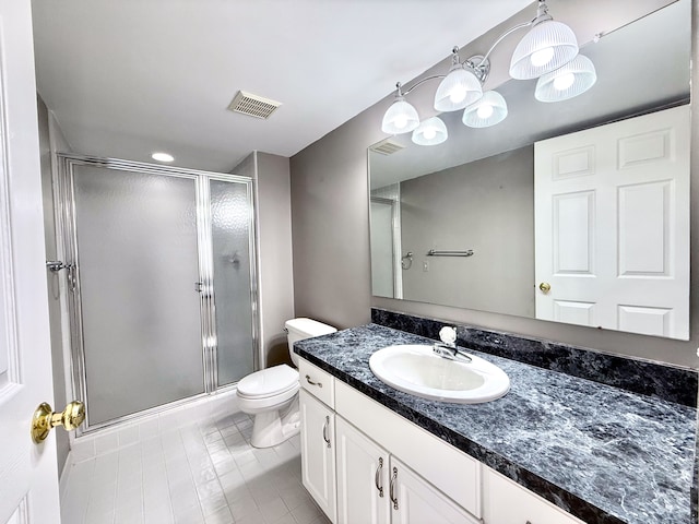 bathroom featuring visible vents, vanity, toilet, and a shower stall