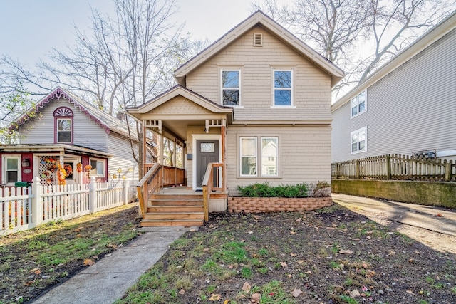 view of front of home featuring fence