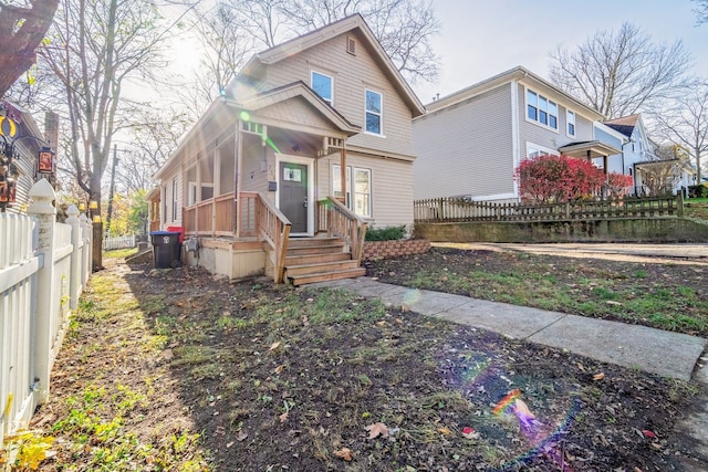 view of front of property featuring fence