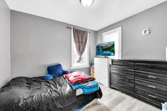 bedroom featuring wood finished floors