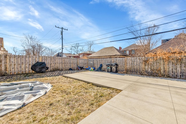 view of yard with a patio area and a fenced backyard