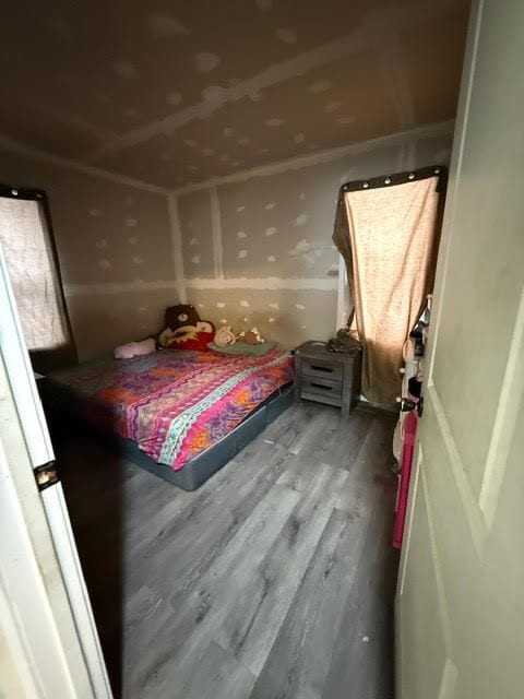 bedroom with wood finished floors