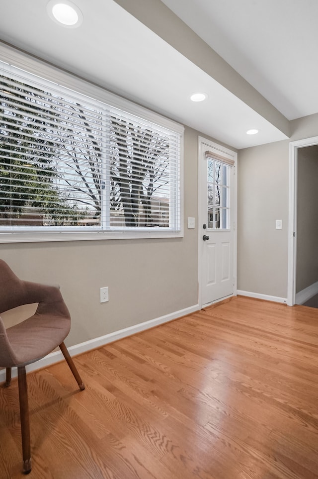 foyer entrance featuring recessed lighting, light wood-style floors, and baseboards