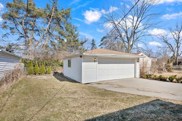 detached garage featuring fence