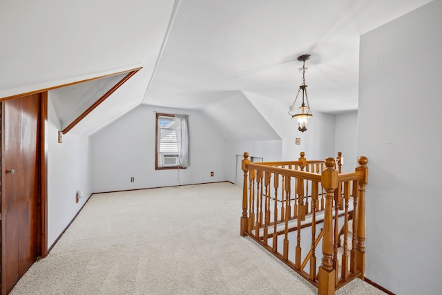 additional living space featuring lofted ceiling and carpet floors