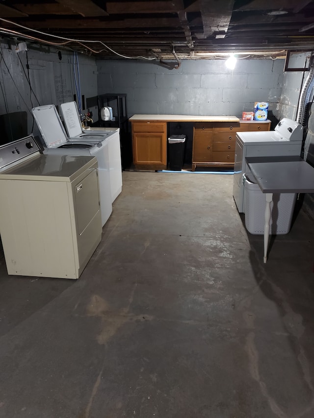 unfinished basement featuring washing machine and dryer