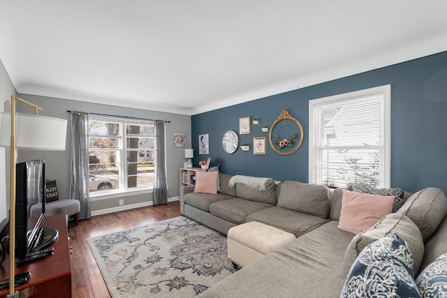 living room featuring baseboards and wood finished floors