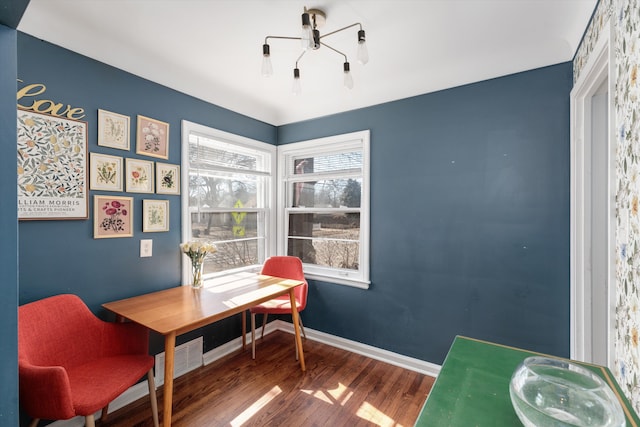 office area with visible vents, wood finished floors, and baseboards