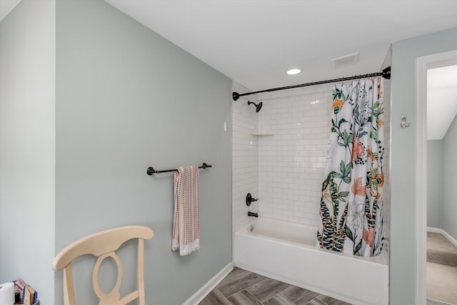 full bathroom with wood finished floors, baseboards, visible vents, recessed lighting, and shower / bath combo