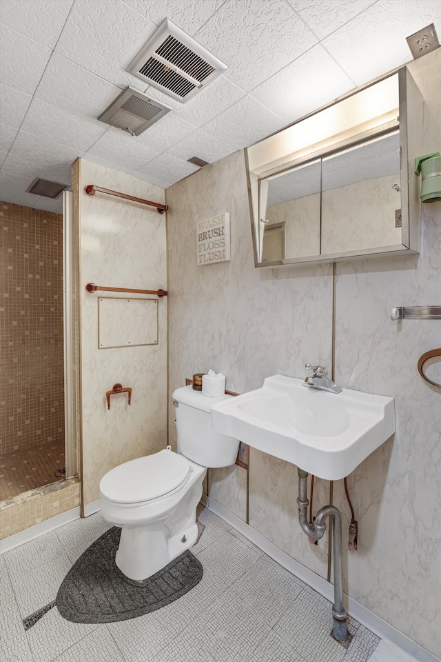 full bath with tile patterned flooring, toilet, visible vents, and a stall shower