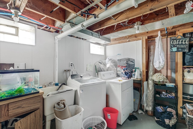 clothes washing area with washer and dryer and laundry area