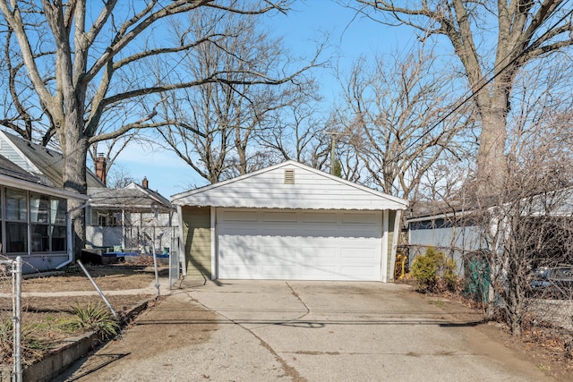 exterior space featuring a detached garage and an outdoor structure