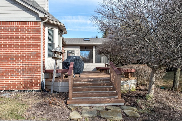 wooden deck featuring area for grilling