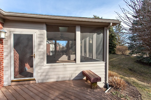 wooden deck featuring a sunroom