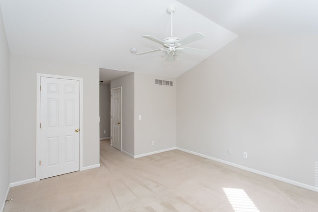 unfurnished room with a ceiling fan, baseboards, visible vents, and light carpet