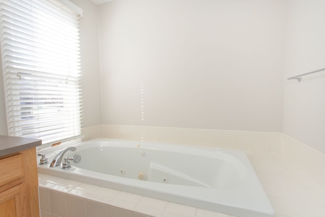 bathroom featuring vanity and a whirlpool tub