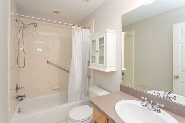 full bath with vanity, toilet, and shower / tub combo