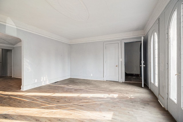 empty room featuring ornamental molding