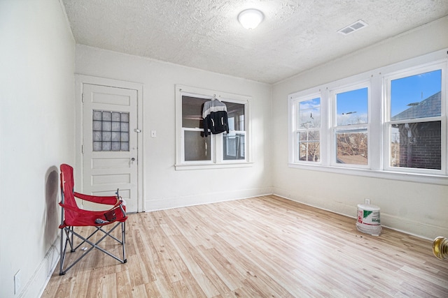 sunroom featuring visible vents