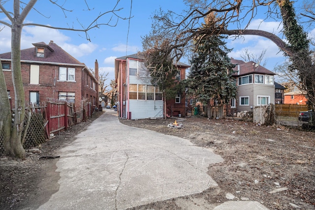 exterior space with a residential view and fence