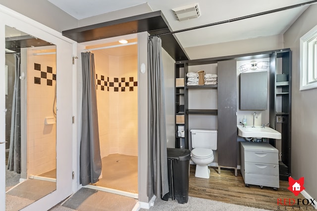 full bathroom with a sink, visible vents, and a stall shower