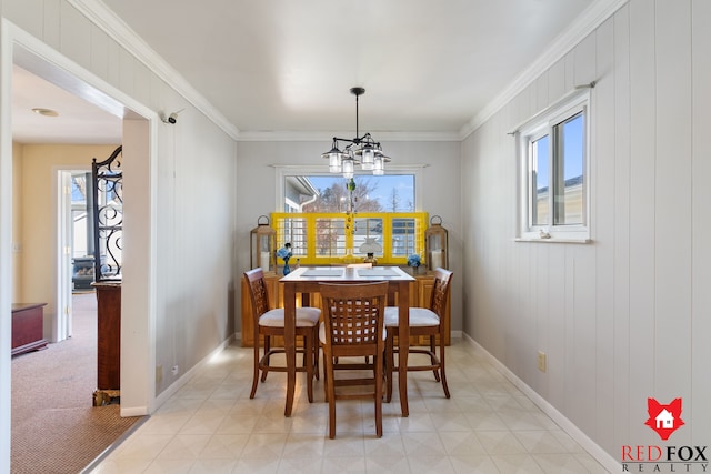 dining space with a wealth of natural light, crown molding, and an inviting chandelier