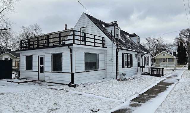 view of front of home with a balcony