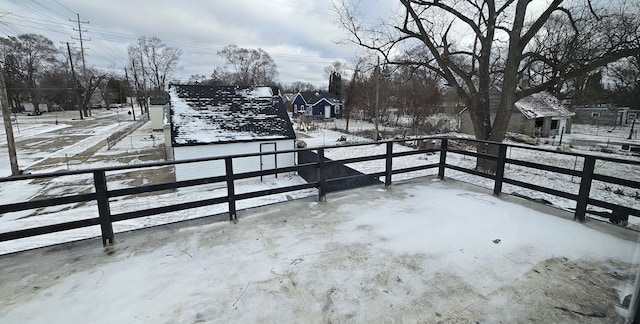 snow covered patio with fence