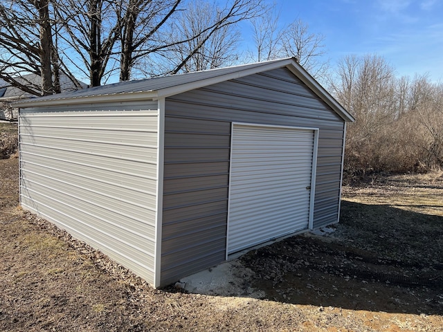 view of outbuilding with an outbuilding and driveway