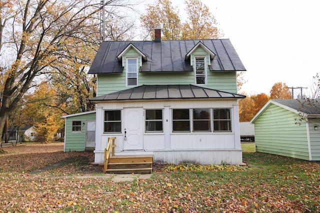 view of front facade featuring metal roof and a standing seam roof