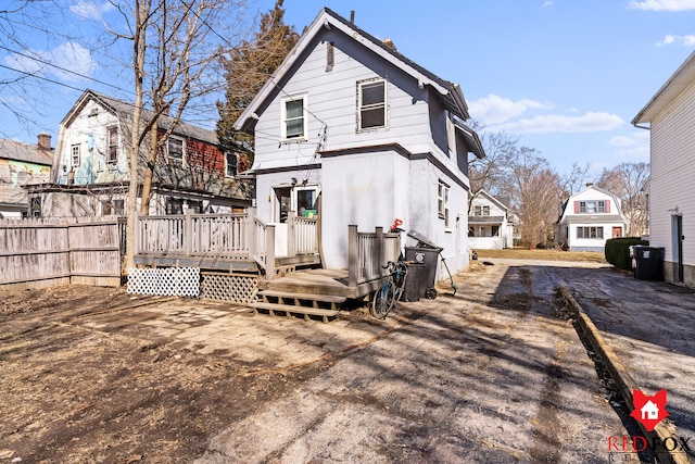 rear view of house with a wooden deck