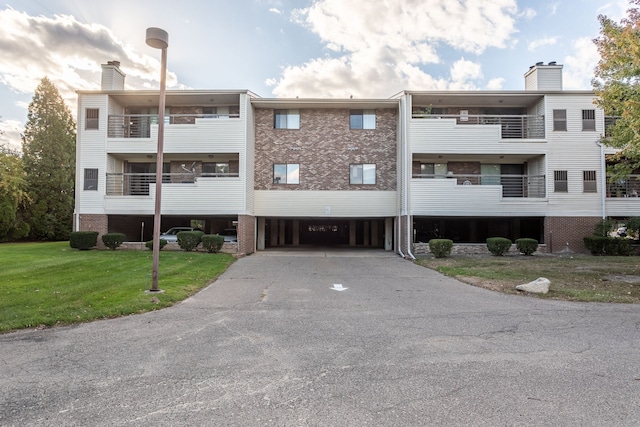 view of building exterior with driveway