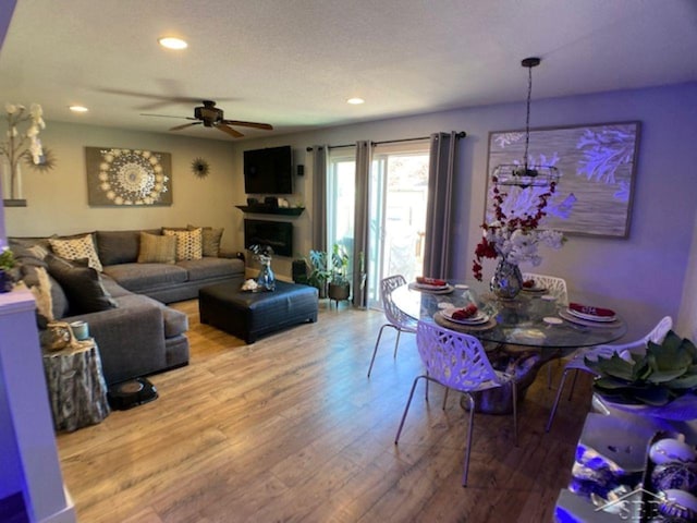 living area featuring recessed lighting, wood finished floors, and a ceiling fan