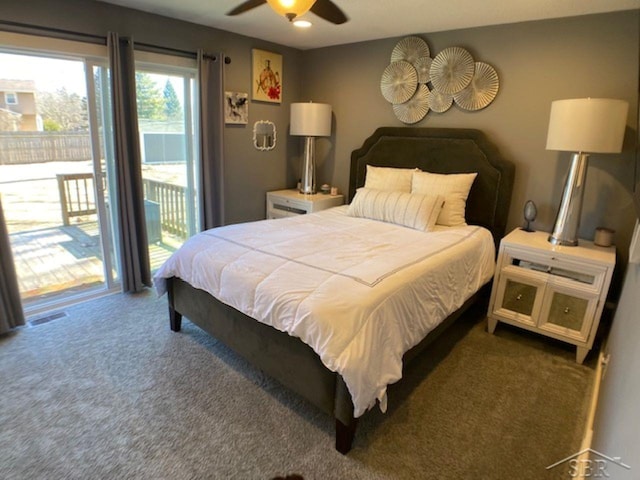 carpeted bedroom featuring access to exterior, visible vents, and ceiling fan