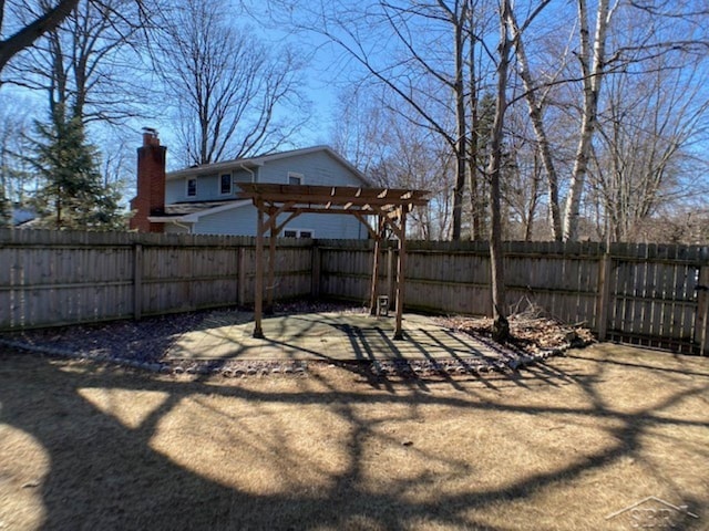 view of yard featuring a pergola and a fenced backyard