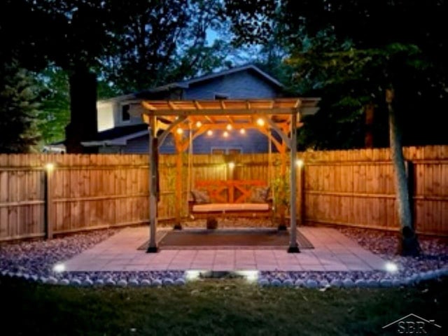 view of patio with fence and a pergola