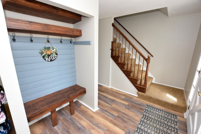 mudroom featuring baseboards and wood finished floors