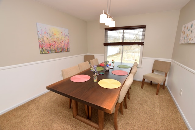 dining room with baseboards and carpet flooring