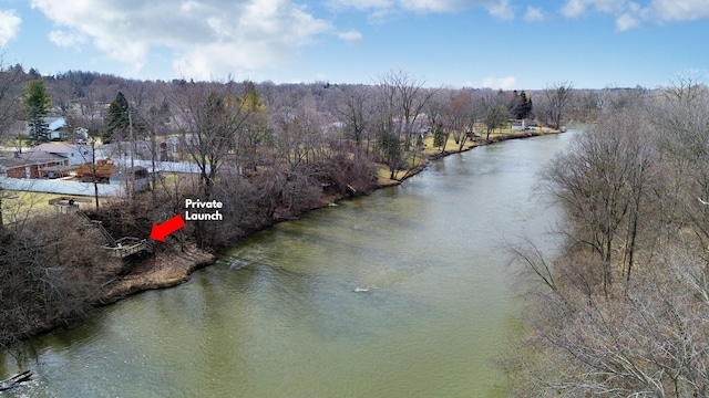 property view of water with a wooded view