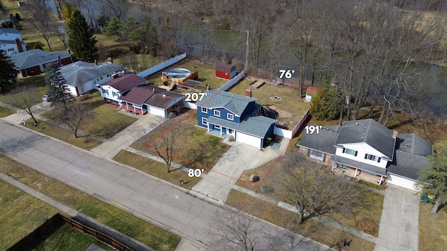 birds eye view of property with a residential view