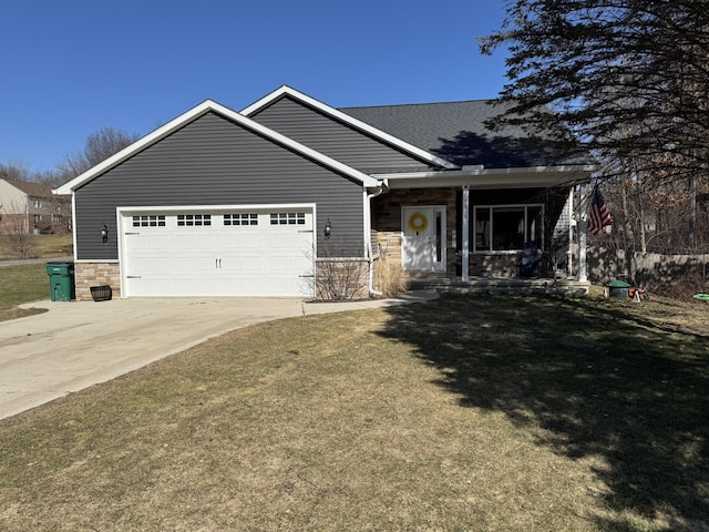 view of front of property with concrete driveway, stone siding, a garage, and a front yard