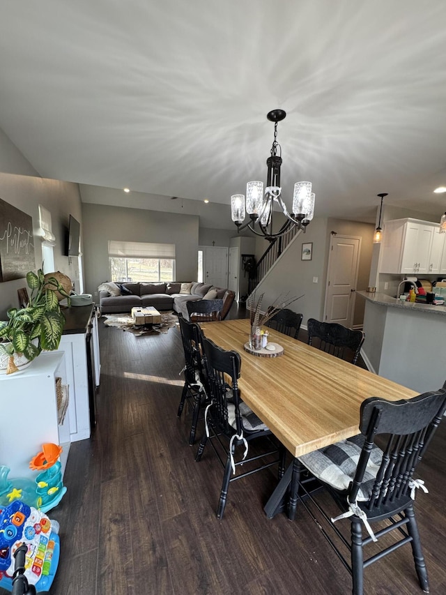 dining room featuring dark wood-style floors, a notable chandelier, and recessed lighting