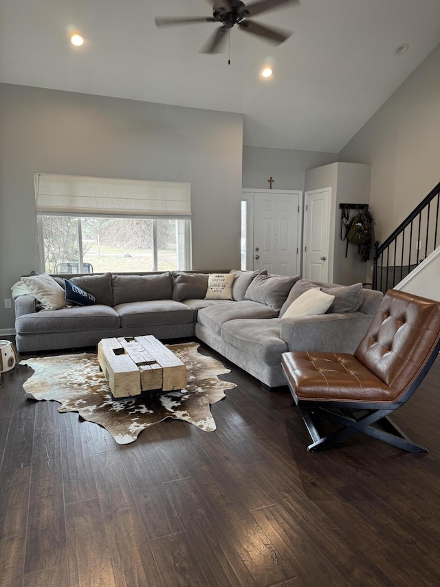 living room with hardwood / wood-style floors, recessed lighting, lofted ceiling, ceiling fan, and stairs