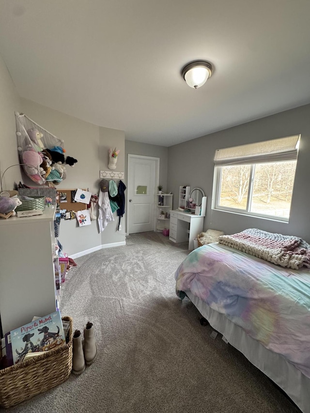 carpeted bedroom with baseboards