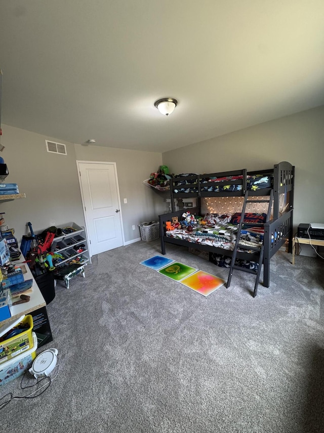 bedroom with visible vents and carpet floors