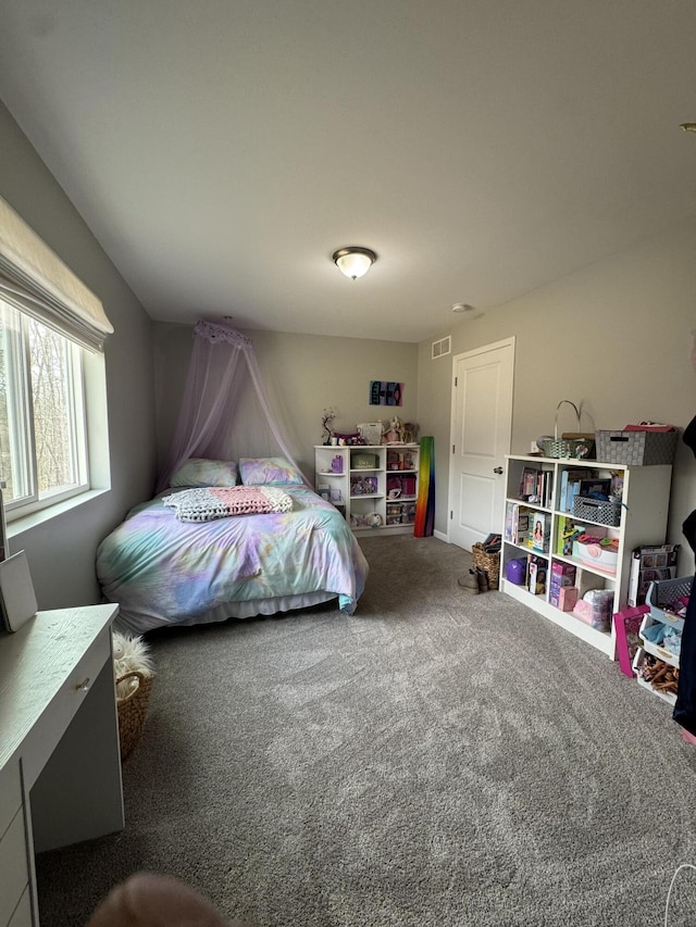 carpeted bedroom with visible vents