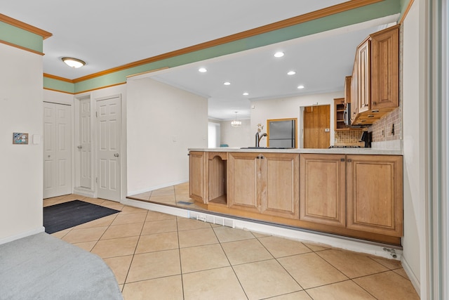 kitchen with crown molding, decorative backsplash, recessed lighting, a peninsula, and light tile patterned flooring