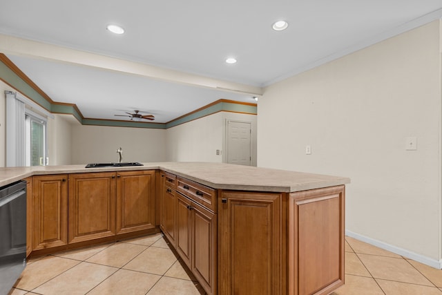 kitchen featuring light tile patterned floors, ornamental molding, a sink, light countertops, and stainless steel dishwasher