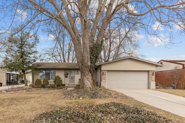 ranch-style home with a garage, brick siding, and driveway