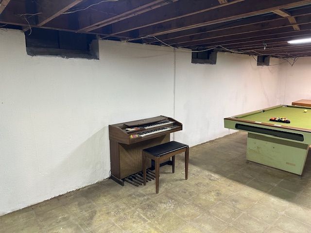 finished basement with billiards and tile patterned floors